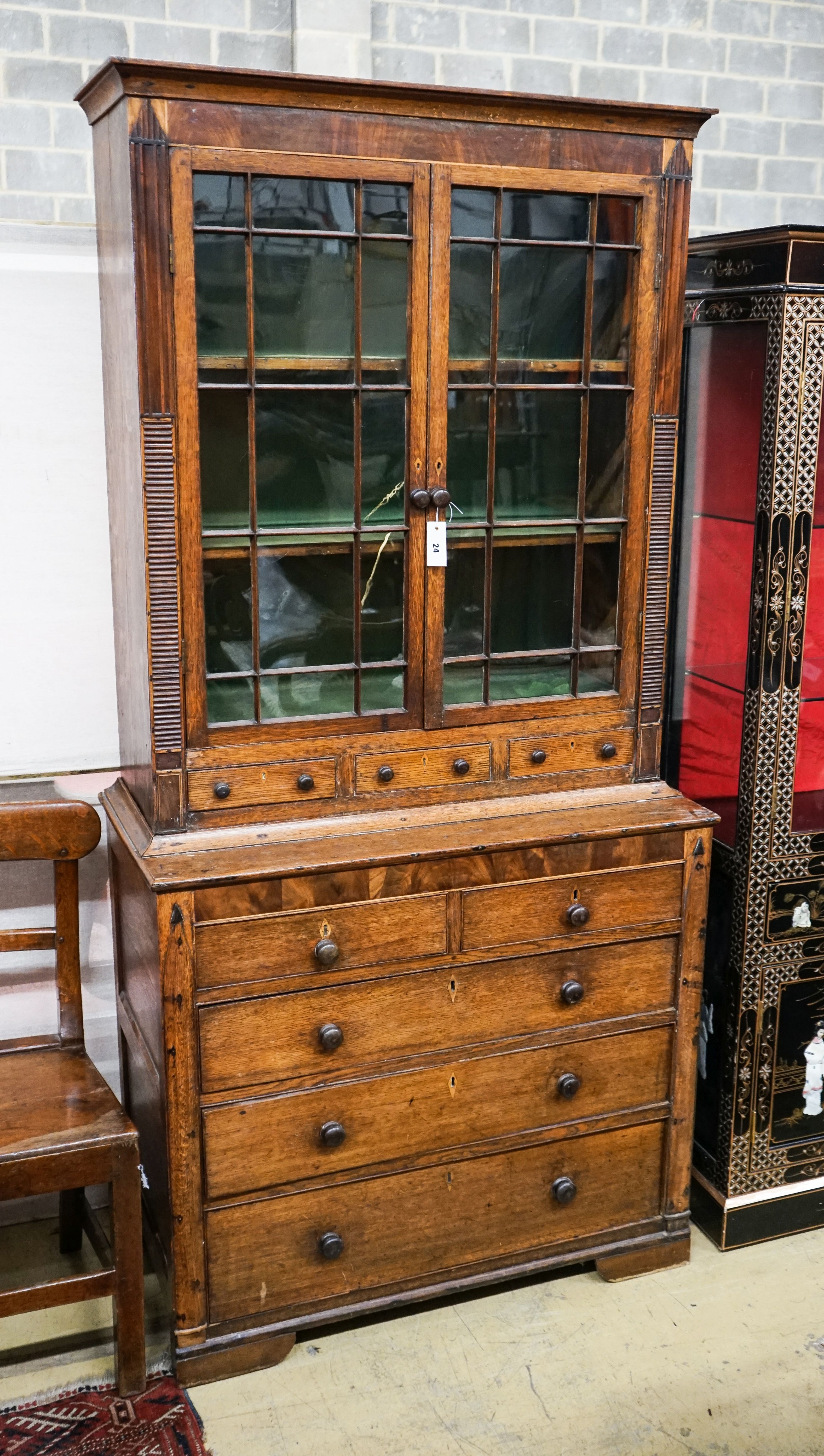 A George IV oak and mahogany bookcase on chest, width 97cm, depth 47cm, height 202cm